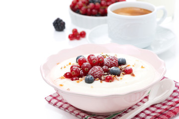 semolina porridge with fresh berries, nuts and coffee, isolated