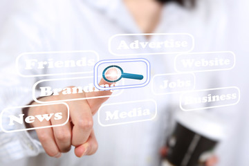 Business woman pressing search button