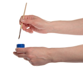 Brush of the artist in blue paint with flasks