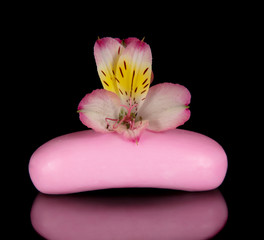 Fototapeta na wymiar Beautiful flower and piece of soap