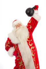Santa Claus raises a cast iron weight.
