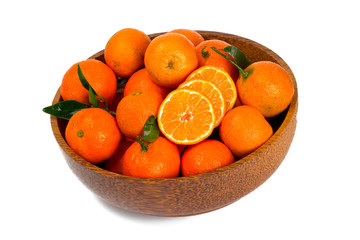 tangerines in a wooden bowl isolated on white