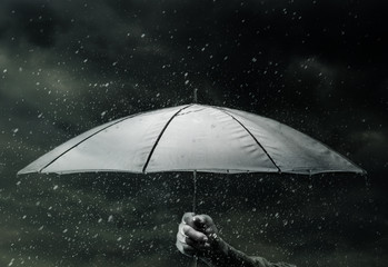 Umbrella under raindrops
