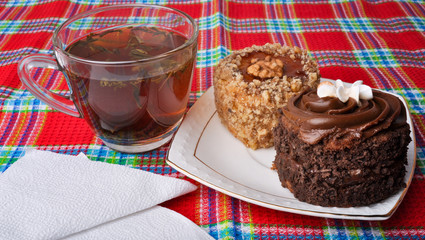 Mug with tea and delicious Cake