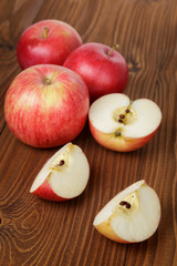 ripe red apples on wood table