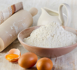 flour on wooden table .