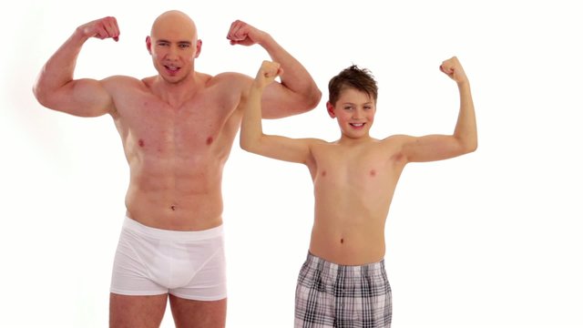 bodybuilder and boy compare their strength