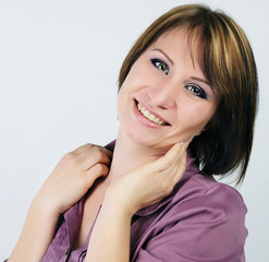 Fototapeta premium young emotional girl in a purple shirt with a short haircut