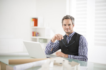 Fototapeta premium architect working at his laptop on the office