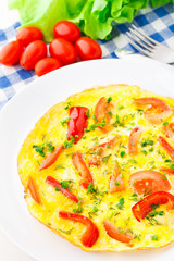 Omelet with paprika, tomato and herbs