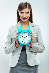 Business woman hold watch. Time concept. Smiling girl portrait,