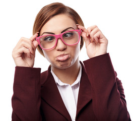 Woman wearing nerg glasses and making funny faces