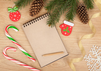 Blank notepad and christmas decor on wooden table