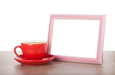 Fototapeta na wymiar Photo frame and coffee cup