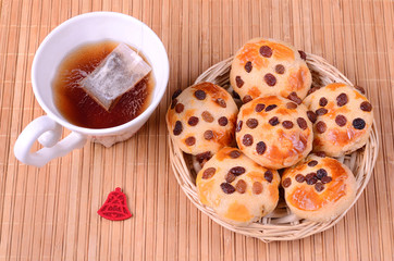 Tasty cookies with cup of tea