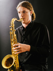 Fototapeta na wymiar Young saxophone player