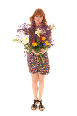 Red haired girl standing with bouquet flowers isolated over whit