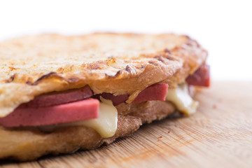 Grilled cheese  and sausage sandwich close-up