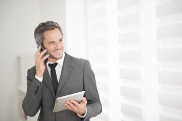 young businessman surfing on tablet