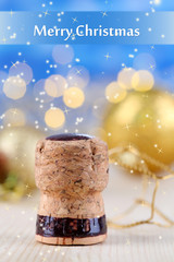 Champagne cork on Christmas lights background