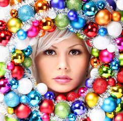 Christmas Woman with Colored Balls. Face of Beautiful Girl