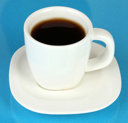 A cup of strong coffee on blue background