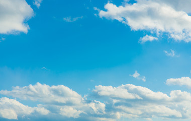 cottony cloud and blue sky on a sunny day