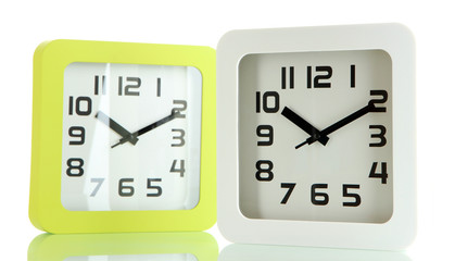 Two office clocks, isolated on white