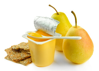 Fototapeta na wymiar Tasty yogurt in open plastic cup, cookies and fruit, isolated