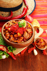 Chili Corn Carne - traditional mexican food, in wooden bowl,
