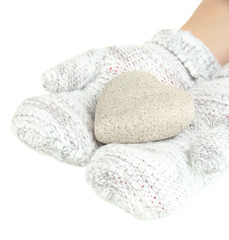Female hands in mittens with heart, close-up