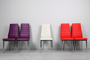 Modern  color chairs on wall background