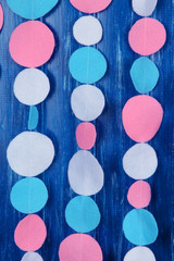 Decorative felt garland on wooden background