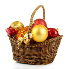 Christmas decorations in basket isolated on white