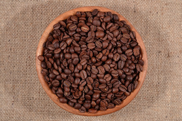 Coffee beans in a wooden bowl