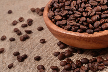 Coffee beans in a wooden bowl