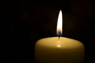 candle on a black background