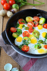 fried quail eggs and vegetables