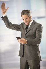 Fototapeta premium good news on smartphone for a businessman