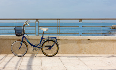 Fototapeta premium Blue Bicycle on a Terrace by the Sea