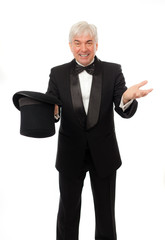 Elegant man in tuxedo and top hat a white background.