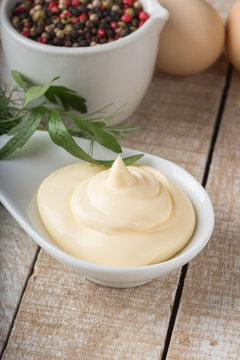 Mayonnaise in bowl on table