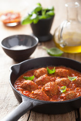 meatballs with tomato sauce in black pan