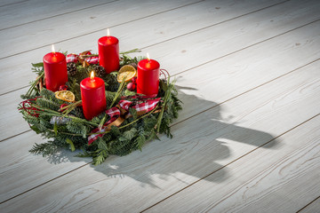Advent wreath with burning red candles