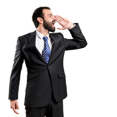 Young businessman screaming over white background