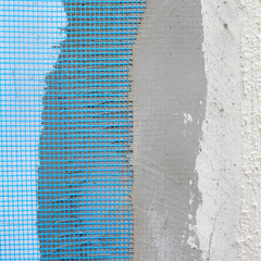 Layers of styrofoam insulation, mesh, plaster, cement, mortar