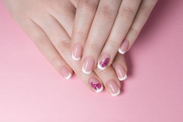 Naklejka premium Fingernails with classic white french manicure