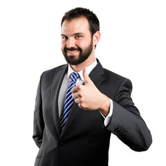 Young businessman getting OK over white background