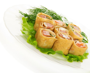Pancakes with salmon and salad