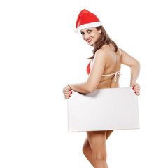 sexy girl in a bikini and santa hat holding a blank sign